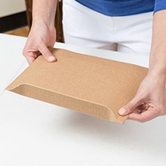 Pull the spine edges of the mailer box to completely cover the product.