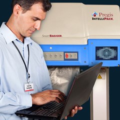 A technician is using the IntelliPack® SmartBagger™ machine.