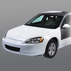 Temporary film protection is covering the body of a brand new car.