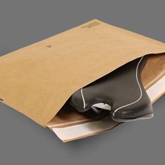 A bike seat is placed inside an EverTec™ Curbside Recyclable Padded Mailer.
